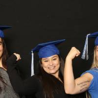three ladies doing muscle sign